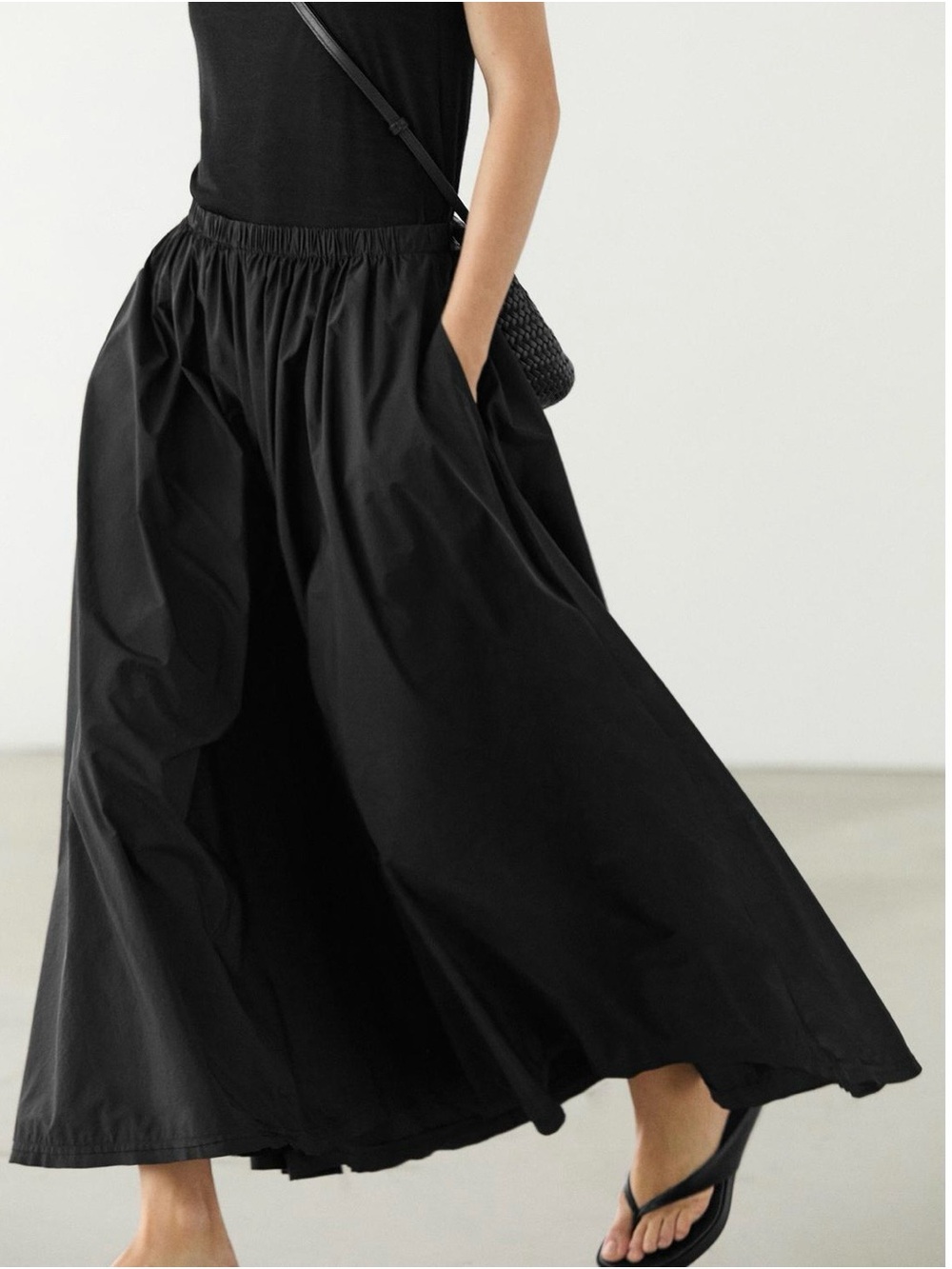 Zara Technical Fabric Black Midi Skirt with elastic waistband. Size XS-S.